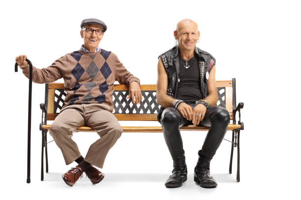 istock Punk and senior man sitting on a bench 1218532723