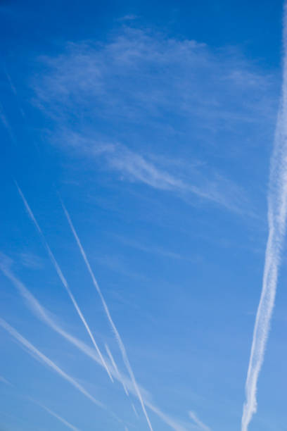 istock Aeroplane vapour trails in jet stream from jet aircraft. 1218534377