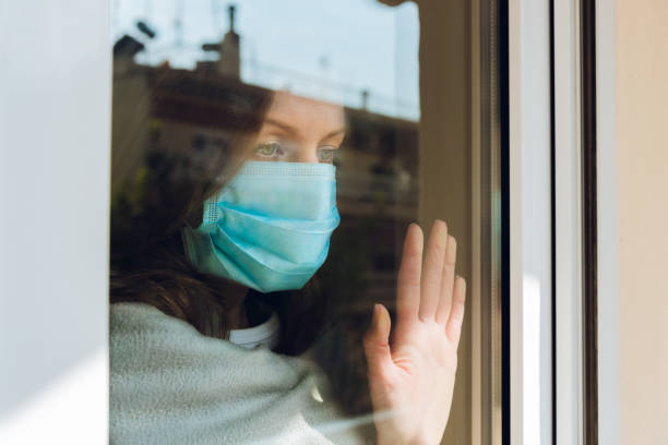 istock Woman with medical face mask. 1218537338