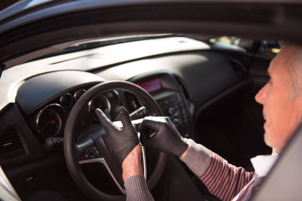istock Senior man puts on protective gloves 1218538124