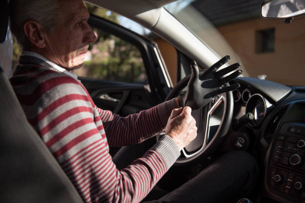 istock Senior man puts on protective gloves 1218538255
