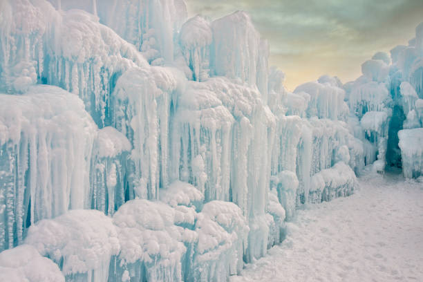Sun setting over ice formation in cold winter temperatures. Horizontal outdoor landscape