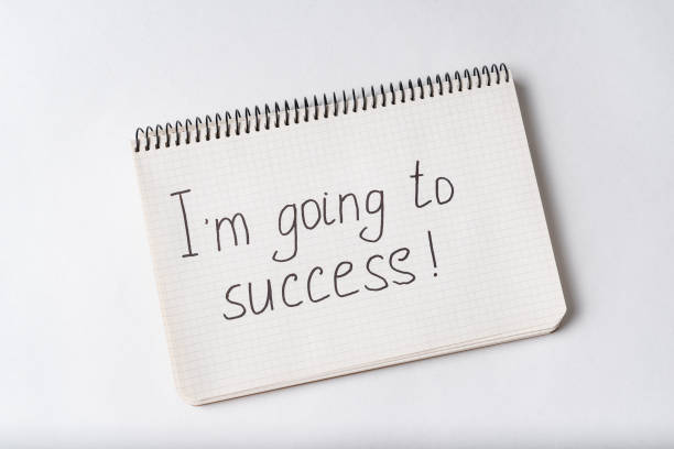 istock Im going to success, inscription in notebook. White background. 1218539885