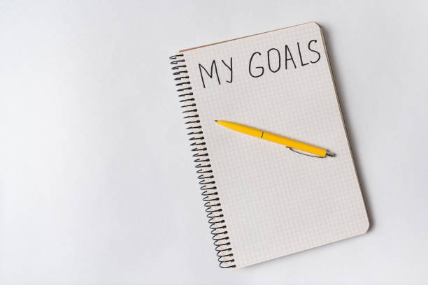 istock Inscription in copybook MY GOALS. Pen and notebook. 1218539958