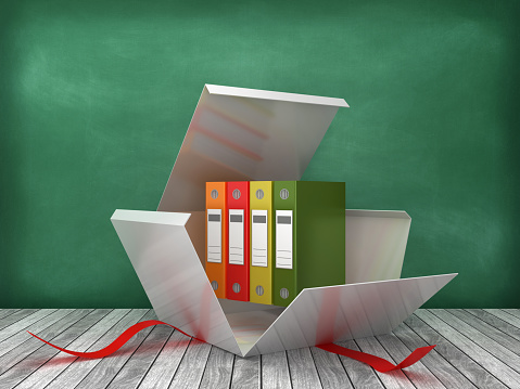 Gift Box with Ring Binders on Chalkboard Background - 3D Rendering