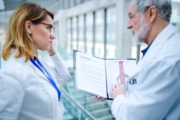 istock Doctors talking about corona virus on conference. 1218542714