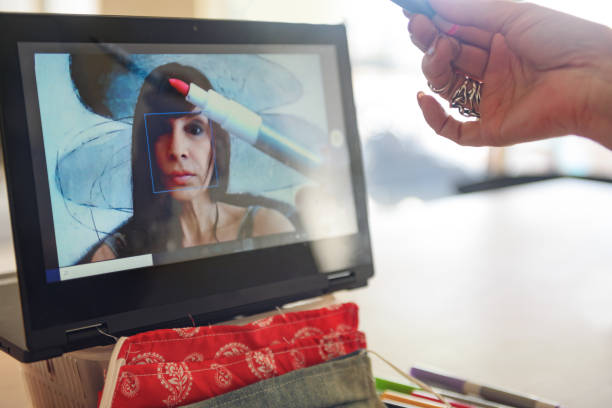 istock Woman doing a live video to show how to make creative cute protective masks 1218543833