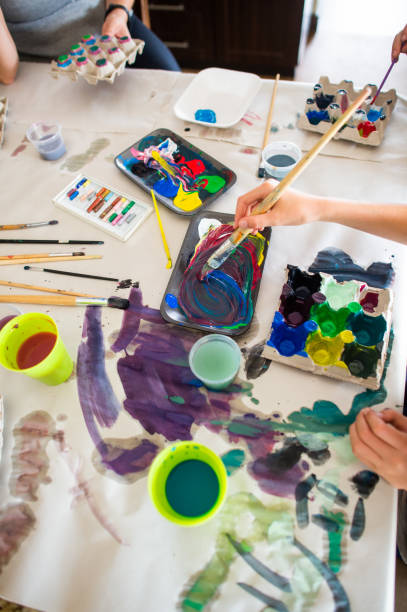 istock Home school art and craft class mixing paint making colours 1218546442