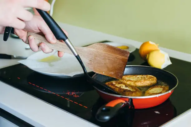 Photo of Cooking torrijas, a typical Spanish sweet fried toasts of sliced bread soaked in eggs and milk.