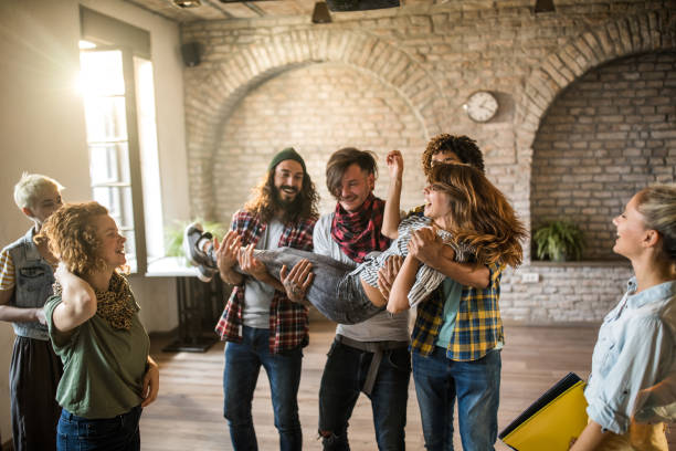 istock Large group of happy creative people having fun at casual office. 1218547715