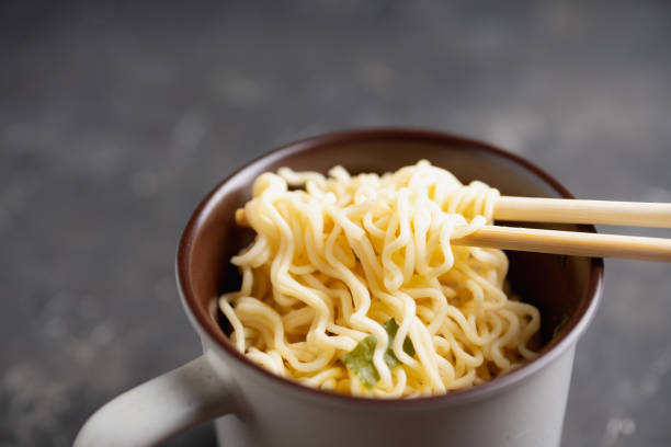 istock Instant noodles in cup on the rustic background 1218549553