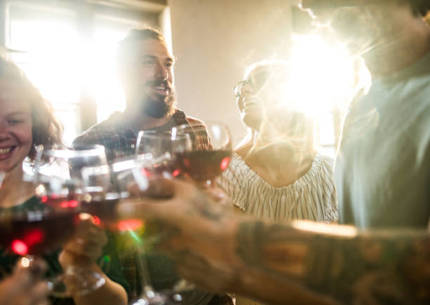 istock Cheerful colleagues toasting with wine at office party. 1218549857