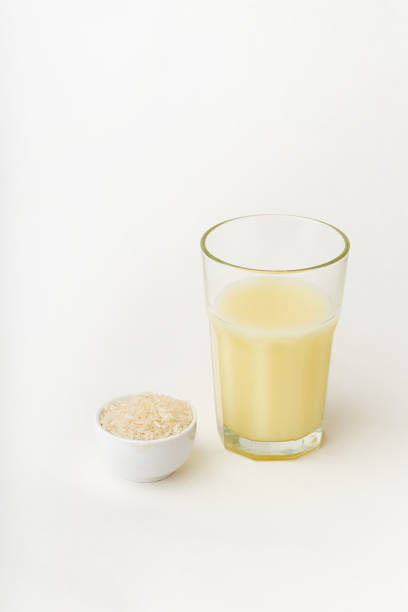 istock Dairy alternative. Rice milk in a high glass on white background. 1218550452