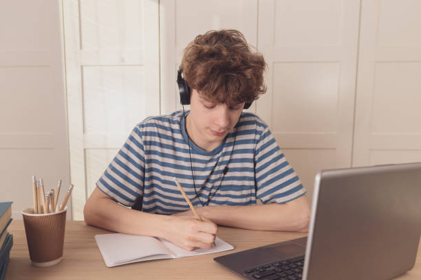 istock A thoughtful kid at his desk is thinking about learning.Distance learning because of the epidemic coronavirus 1218551724