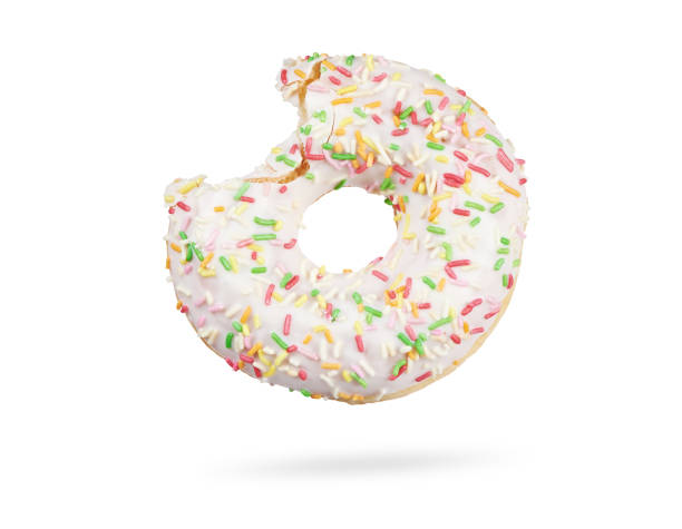 istock bitten donut with colorful sprinkles isolated on white 1218559366