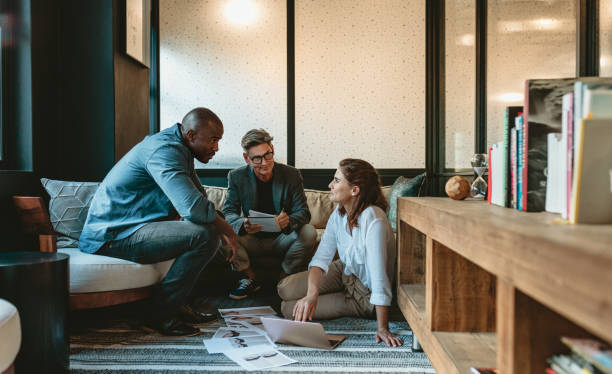 istock Marketing team discussing new project in creative office 1218559600