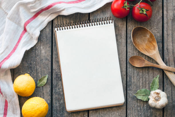 Blank recipe cooking book and utensils. Top view with copy space