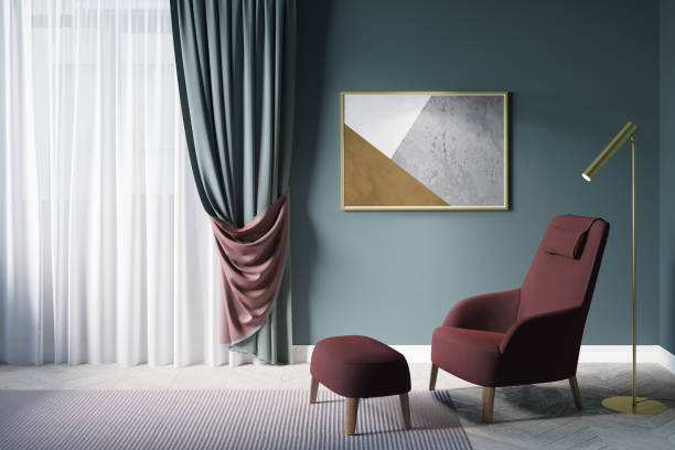 istock Cozy green living room. Window with dense green curtains with a burgundy wrong side, a horizontal poster above a burgundy armchair with a pouf for legs next to the lamp. Front view. 1218560621