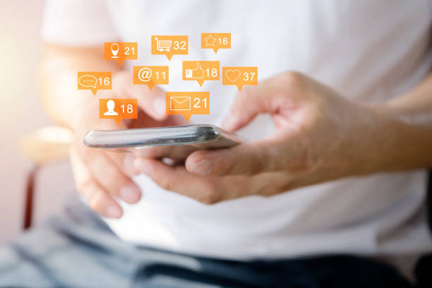 istock Close up of a man using mobile smart phone. Communication icons 1218560922