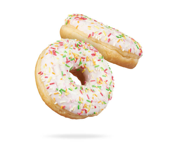 istock donut with colorful sprinkles isolated on white 1218561076