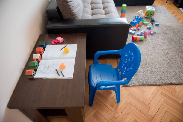 istock Living room used as a children playroom and study room during coronavirus quarantine 1218562249