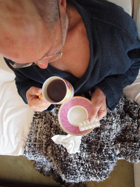 istock Senior man feeling sick at home 1218563031