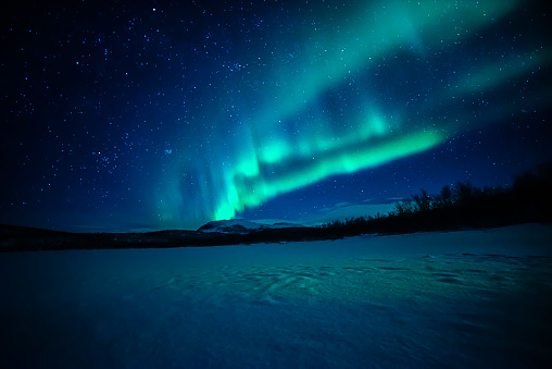 An Aurora dances across the sky in Finland