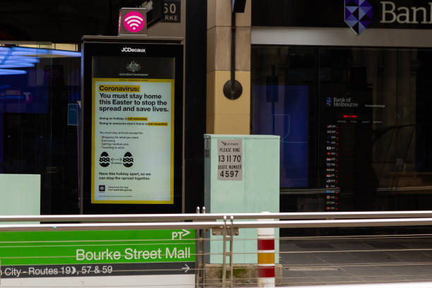 COVID-19 Crisis in Melbourne, Melbourne, Australia Melbourne, Australia, 12 April, 2020. COVID-19 Warning sign at a tram stop during the  COVID-19 Crisis in Melbourne. south yarra stock pictures, royalty-free photos & images