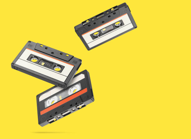 istock Old audio tape compact cassette isolated on yellow background 1218564692