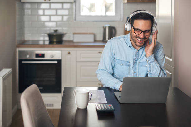 istock Businessman with headset having a video call. 1218564792