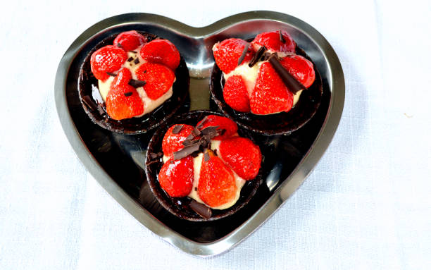 istock Strawberry tarts on heart shaped plate 1218565725