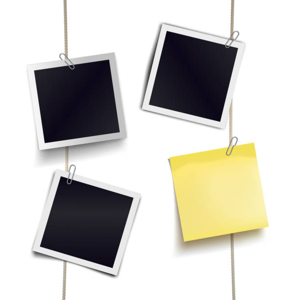 istock Yellow sticky note and photo frames attached metal paper clips on tapes. Template for design. Vector illustration. 1218565888