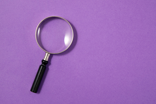 Magnifying Glass On Purple Background Stock Photo - Download Image Now - Purple, Magnifying Glass, Searching - iStock