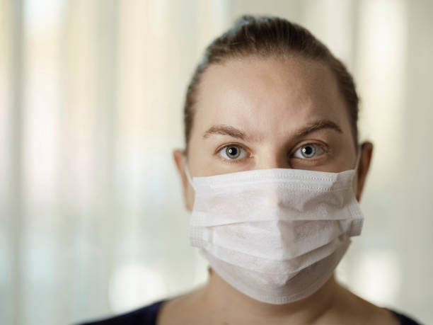 istock Woman with face protective mask 1218568109