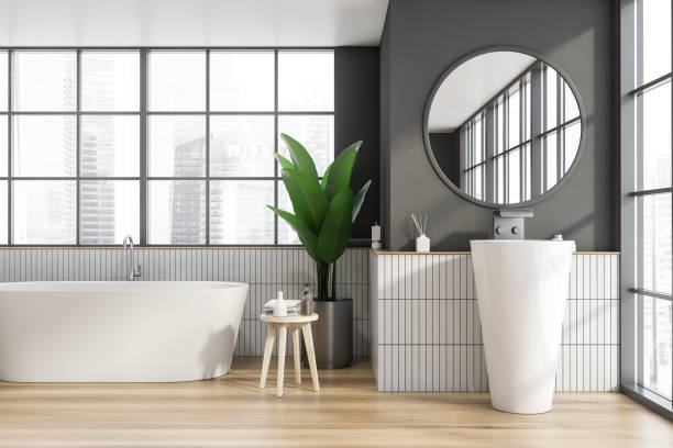 istock White and gray tile bathroom with tub and sink 1218569219