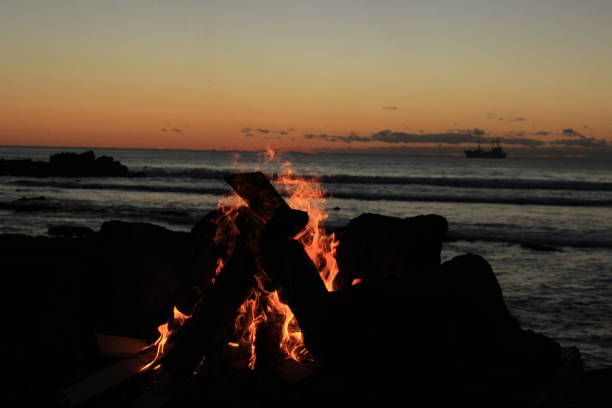 istock Fire Is burning in front of the sea 1218569261
