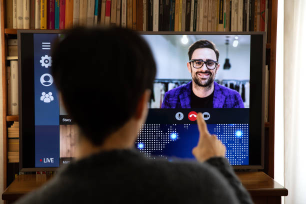 istock Woman in front of a device screen in video conference for work 1218569617