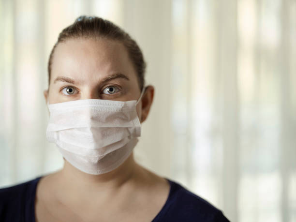 istock Woman with face protective mask 1218569636