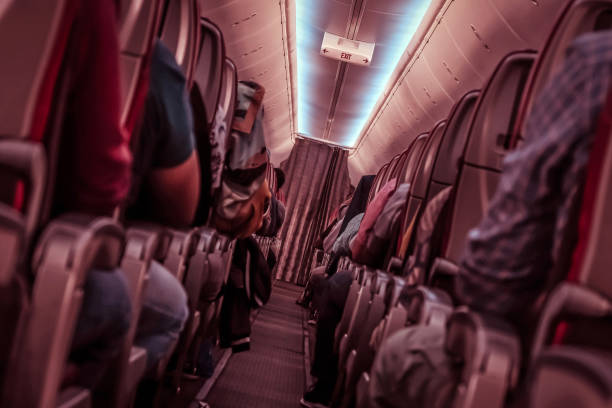 istock Plane danger. Passengers in shock in a turbulence area 1218569889