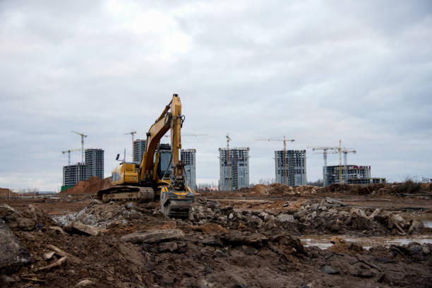 istock Excavator with crusher bucket for crushing concrete. Construction waste recycling for construction mix. Sifting and grinding bucket for the separation of concrete into fractions of higher quality. 1218571648