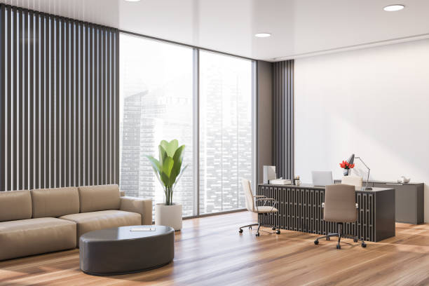 istock Gray and white CEO office with lounge area 1218572131