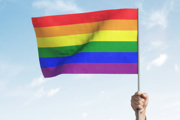 istock LGBT flag in a raised hand. 1218574010