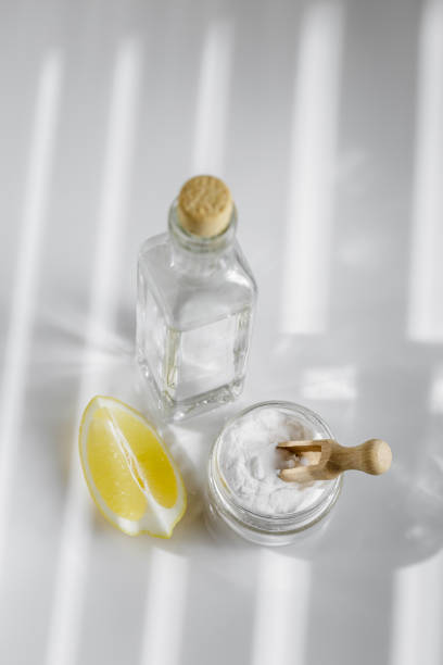 istock Vinegar, baking soda and lemon on white background 1218575546
