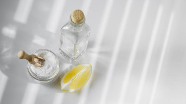 istock Vinegar, baking soda and lemon on white background 1218575619
