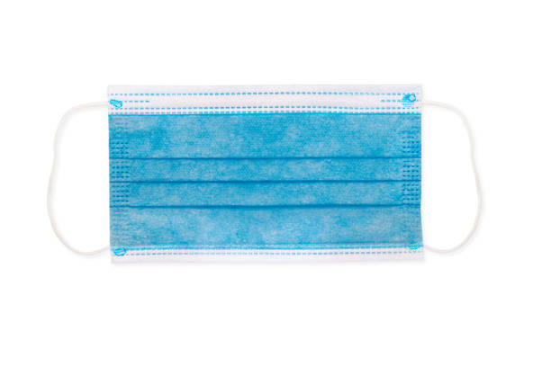 istock Surgical face mask isolated on white background 1218575736