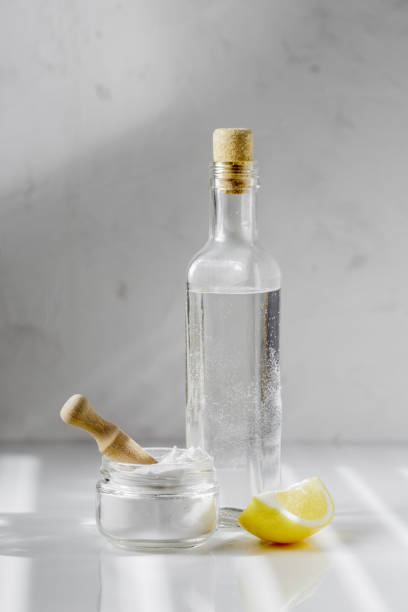 istock Vinegar, baking soda and lemon on white background 1218575744