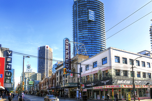 Vancouver, Canada - March 4, 2020: The corner of Granville and Smithe in downtown Vancouver featuring the Orpheum Theatre which opened in 1927.