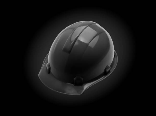 istock Black Safety helmet on black background. construction helmet 1218576914