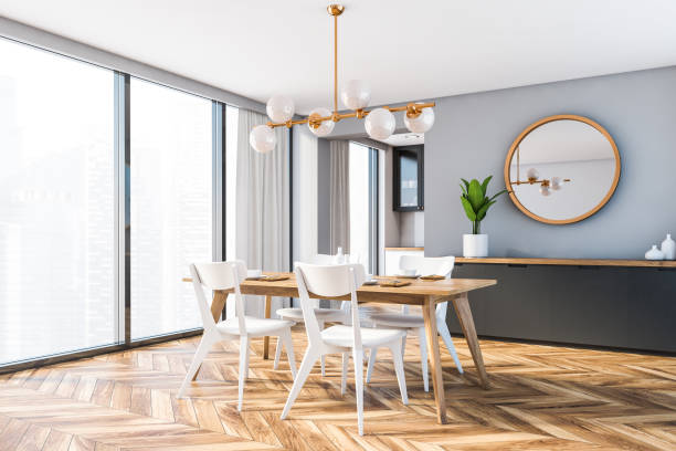 istock Wooden table and cabinet in gray dining room 1218578130