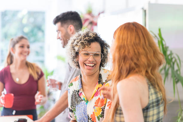 istock Latin American professionals having friday drinks 1218579615